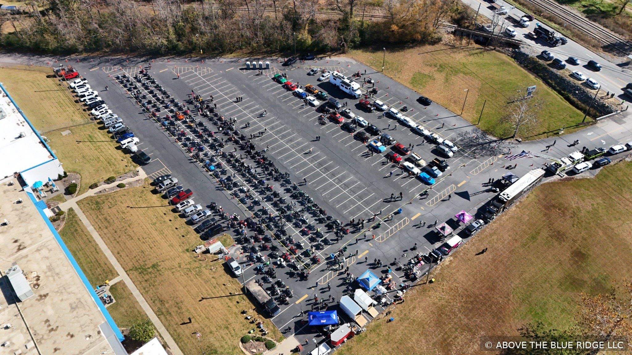 Large outdoor motorcycle event aerial overview
